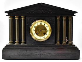 A Victorian black slate mausoleum clock, the enamelled dial set with Arabic numerals, flanked by