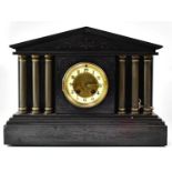 A Victorian black slate mausoleum clock, the enamelled dial set with Arabic numerals, flanked by