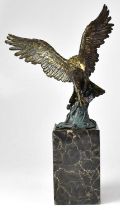 AFTER ANTOINE-LOUIS BARYE (1795-1875); a bronze figure of an osprey with a fish in its talons on a