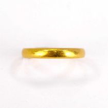 A 22ct yellow gold thin wedding band, size J, approx. 3.3g.