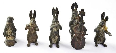 In the manner of Bergman, five cold-painted bronze models of hares playing musical instruments in an