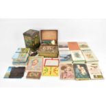 A collectors' lot to include a tin with 'Division One English and Scottish Winners 1900-1926', 16