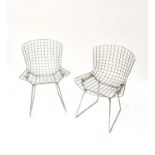 HARRY BERTOIA; four wire chairs, with cream leather seat pads (4). Condition Report: Only three seat