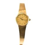 OMEGA; a ladies' 9ct gold wristwatch, the gold dial set with baton numerals, with tiger's eye
