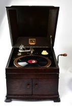 HIS MASTER'S VOICE; an oak cased wind-up gramophone with no.4 needle, 36 x 52 x 43cm.