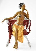 LAGUZO (?); a painted cast metal of a scantily-clad female on a Savonarola-type chair,