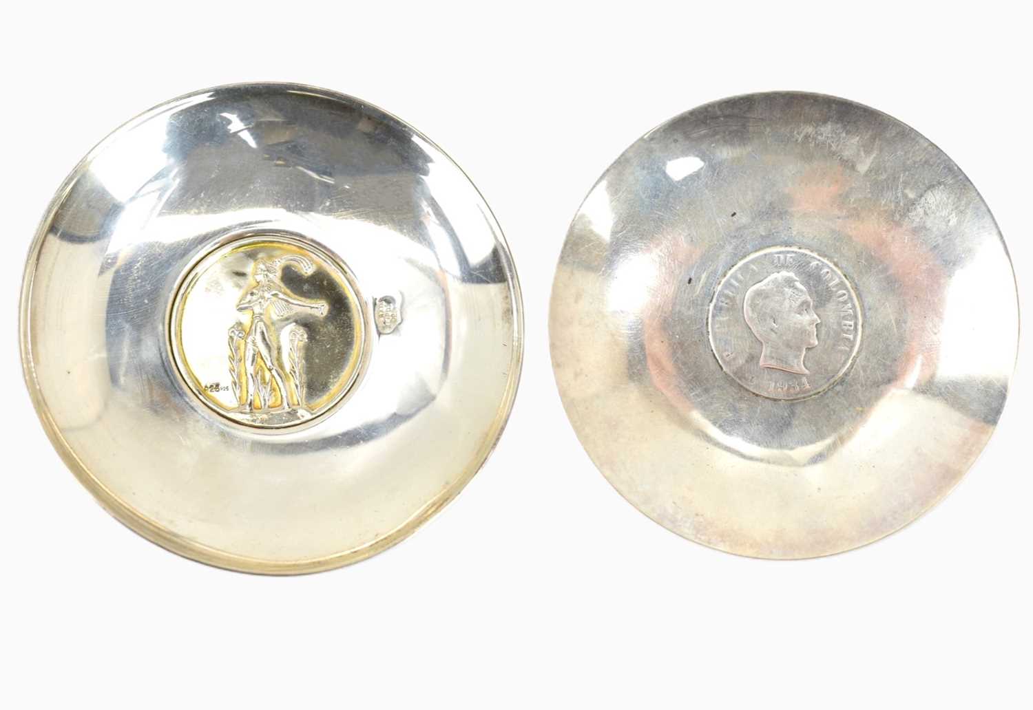 Two silver pin dishes, one with five cent Mexican coin to centre, diameter 8.5cm, the other marked