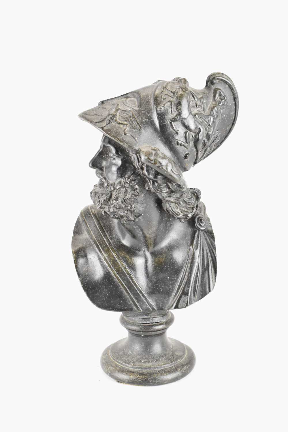 A cast metal bust depicting a Greek warrior with highly decorated helmet, on socle base, height