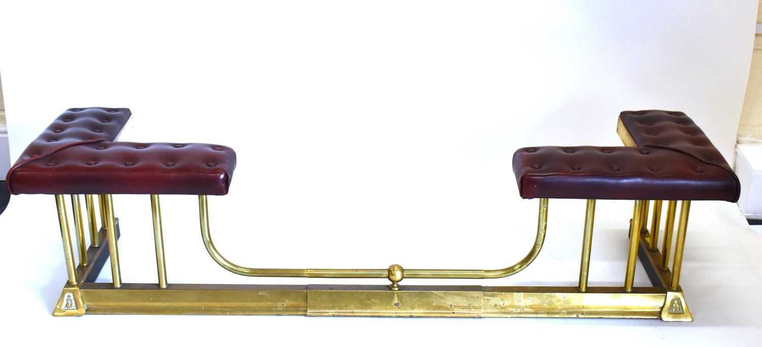 An adjustable club fender with vintage-style buttoned leather seats, raised on gilt metal