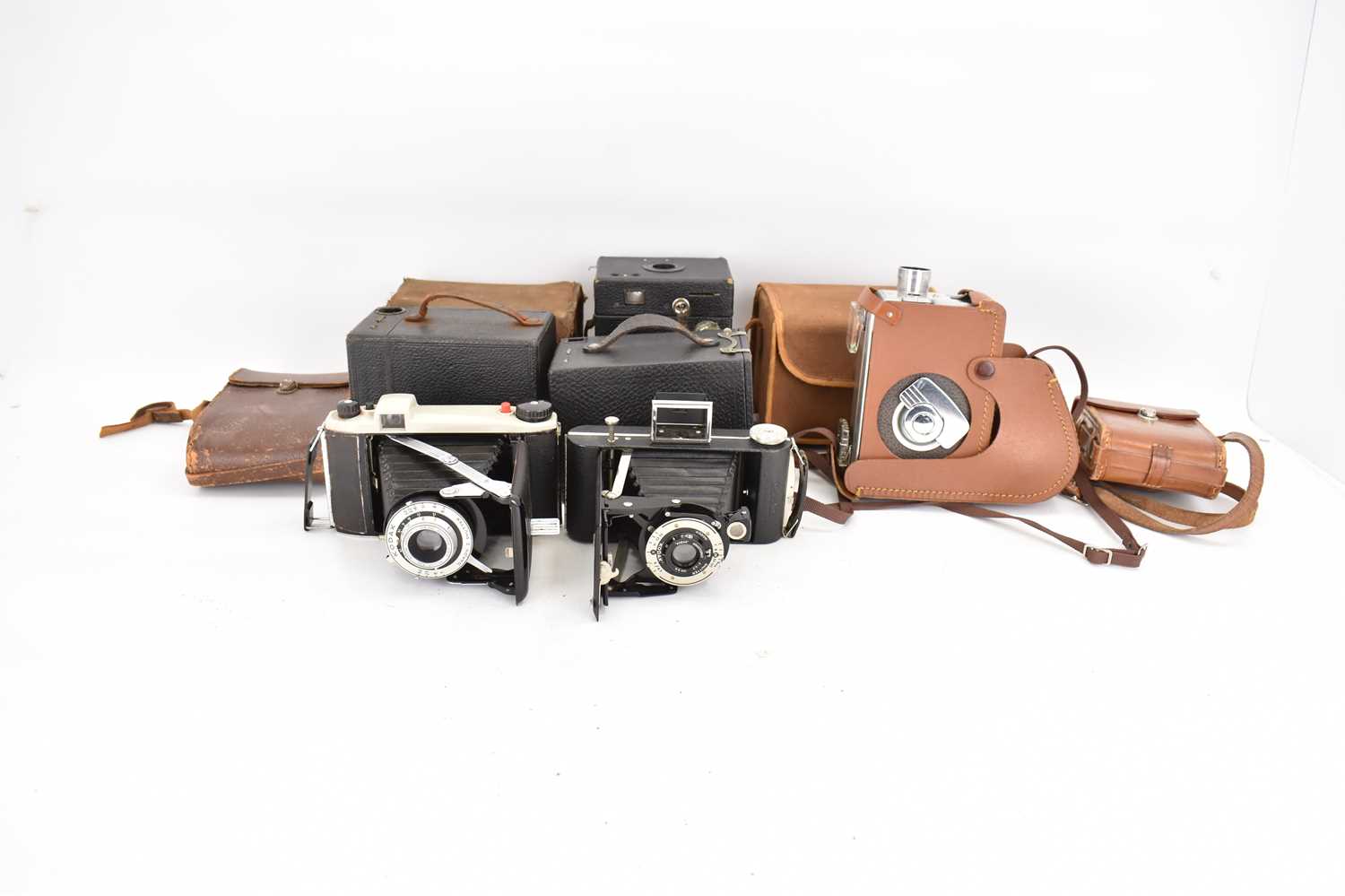 Six vintage cameras comprising two Kodak box Brownies, one APM box camera, two Kodak Junior,