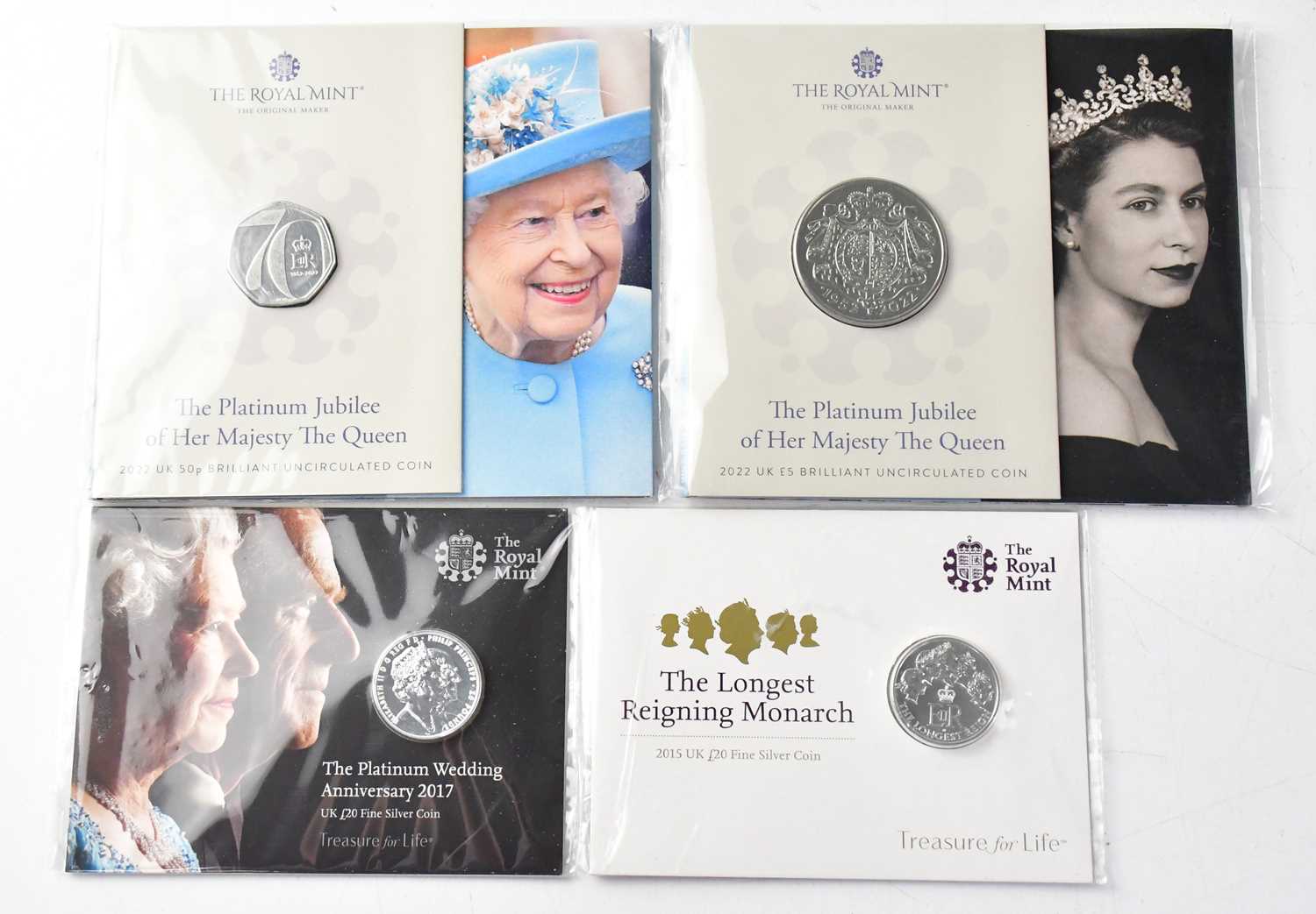 THE ROYAL MINT; four coin packs, comprising 'The Longest Reigning Monarch 2015 UK £20 Fine Silver