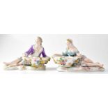 MEISSEN; a pair of 19th century salts in the form of a recumbent lady and gentleman, each holding