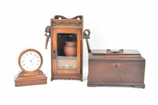 An early Victorian mahogany tea caddy with swing handle (af), 17 x 25cm, a mahogany desktop key wind