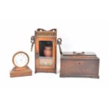 An early Victorian mahogany tea caddy with swing handle (af), 17 x 25cm, a mahogany desktop key wind