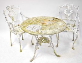 A white painted aluminium circular garden table, 68 x 82cm, and a pair of chairs, in the style of