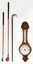 A wall-hanging oak banjo barometer and thermometer with carved oak leaf front, length 80cm (af), a