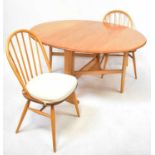 ERCOL; a light elm Windsor gateleg drop-leaf dining table, 72 x 130cm, with four Ercol stick back