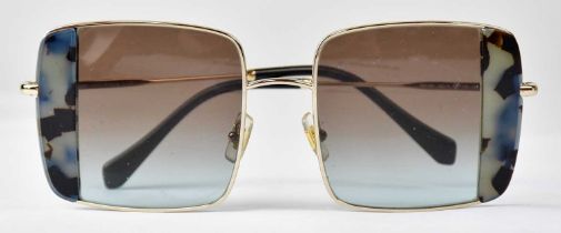 MIU MIU; a pair of MU 56VS ladies' square sunglasses in gold tone with silver grey gradient, with
