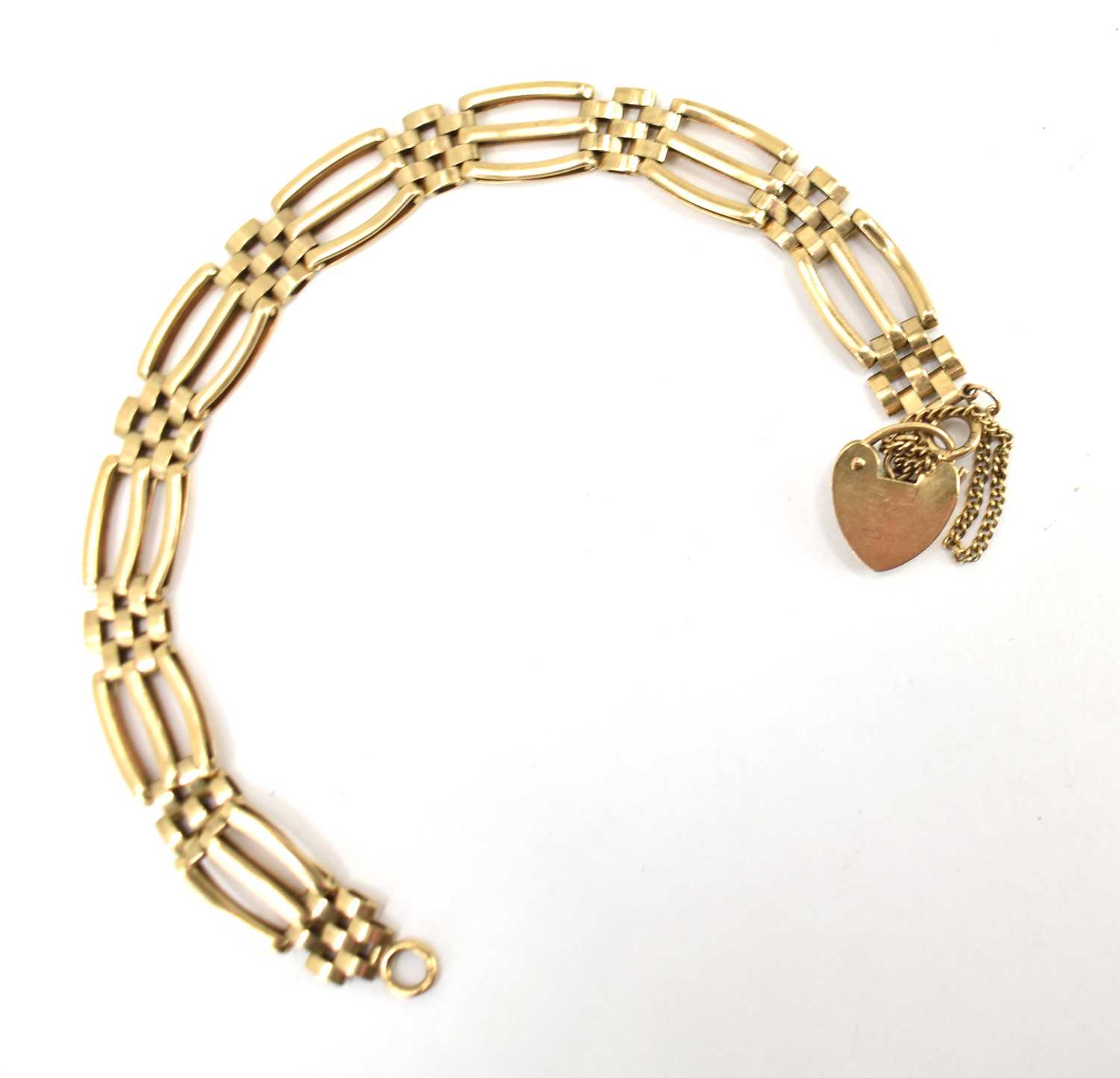 A 9ct gold three-bar link gate bracelet with 9ct gold heart-shaped padlock clasp, length 20cm, - Image 2 of 2