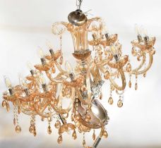 A Murano-style twelve-branch peach glass electrolier, with six further branches to the inner