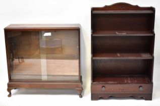 An early 20th century glazed mahogany bookcase with two adjustable shelves, raised on squat cabriole