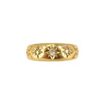 An 18ct gold gentlemen's ring set with three graduated star inset tiny diamonds, size P, approx. 2.