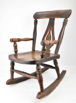 A children's small Windsor rocking chair.