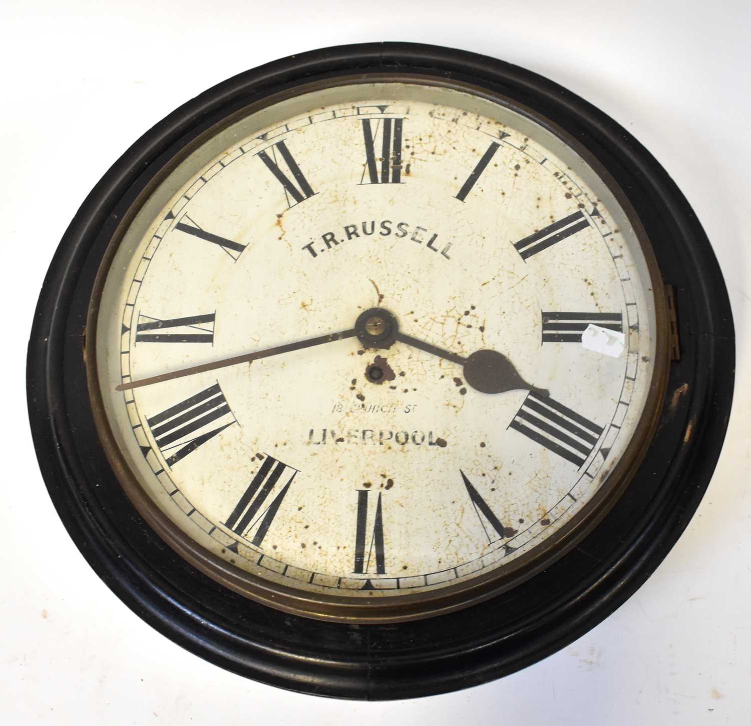 T. R. RUSSELL, LIVERPOOL; an ebonised station clock, the 13.5" white enamelled dial set with Roman