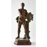 AFTER A. J. SCOTTE (1885-1905); a painted spelter figure of an artist holding a pen and a plaque,