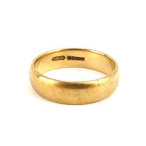 A 9ct gold wide wedding band, size V, approx. 6.3g.