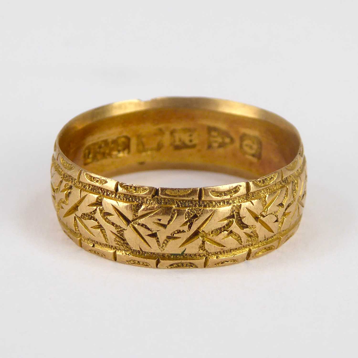 An 18ct gold band ring with textured pattern, size Q, approx. 4.2g. - Image 2 of 2