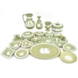 WEDGWOOD; approximately twenty pieces of sage green jasperware, to include ornaments, dishes, vases,