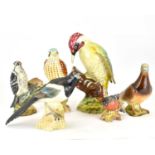 BESWICK; six bird ornaments to include 'Woodpecker' no. 1218, height 21.5cm, 'Falcon' no. 2316, '