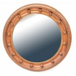 A reproduction overpainted gilt framed convex wall mirror with ball details, diameter 55cm.