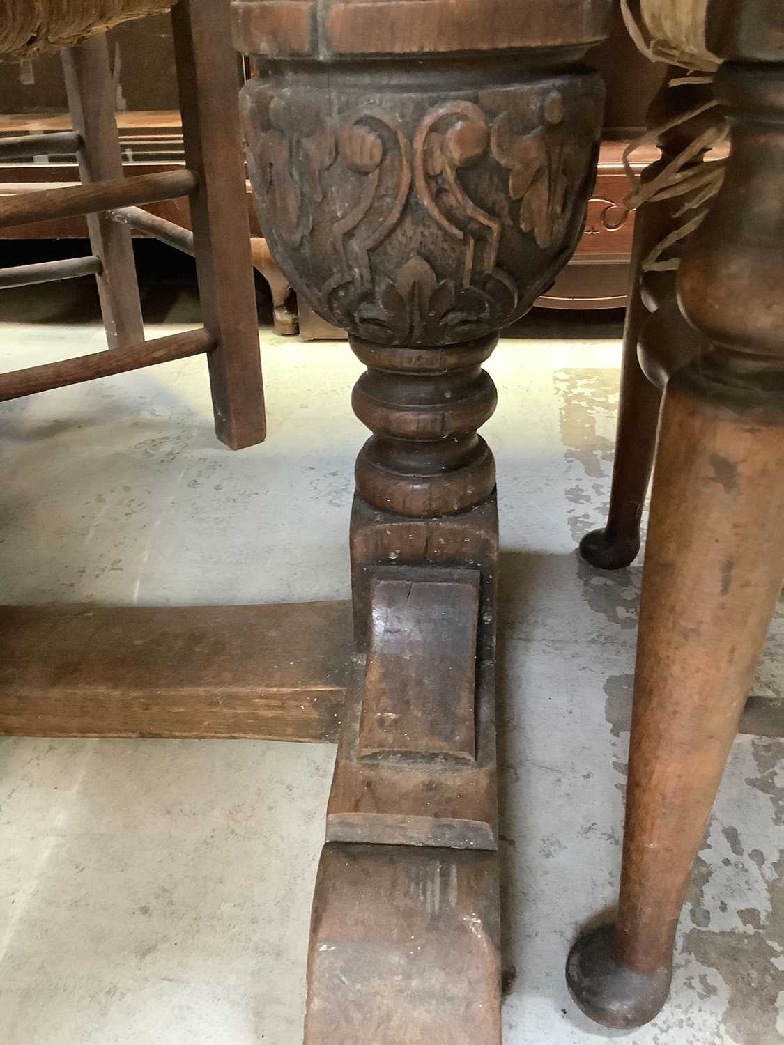 A 19th century oak plank top refectory table on carved cup and cover legs united by a stretcher, - Image 6 of 6