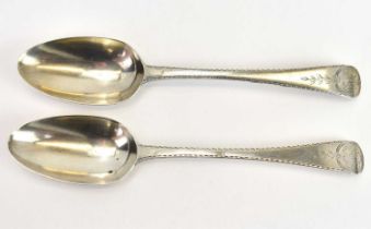 A pair of hallmarked silver George III tablespoons, decorated to the front with the initials 'JW'