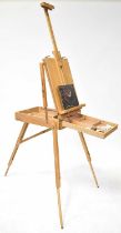 A modern folding artist's easel/work table, with adjustable canvas clamp above single drawer and