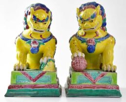 A pair of early 20th century European made Chinese guardian lions and a further pair of turquoise