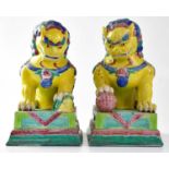 A pair of early 20th century European made Chinese guardian lions and a further pair of turquoise