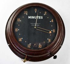 SMITHS; a vintage Bakelite wall-mounted alarm clock, the black dial inscribed 'Minutes' in white