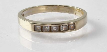 An 18ct white gold ring set with five square cut diamonds, stamped '750, size O, approx. 3g.