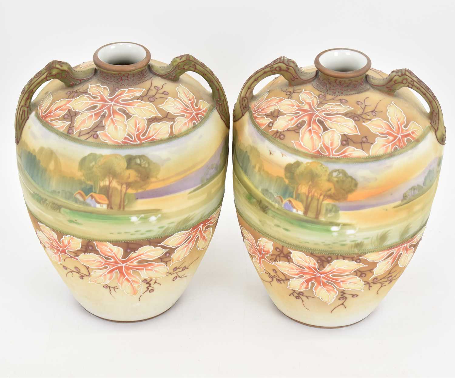 A pair of hand painted Japanese porcelain vases of ovoid form with branch-style handles, a central - Image 2 of 4