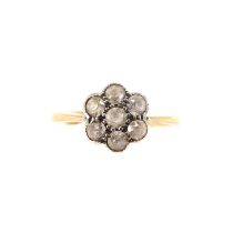 An 18ct gold white stone flower head cluster ring, size N, approx. 2.1g. Condition Report: Not