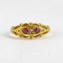 An 18ct gold Victorian-style ring set with two rubies separated with three tiny diamonds, size J,