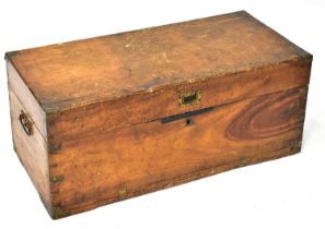 A wooden trunk, possibly elm or ash, with brass fittings, carry handles and candle box to
