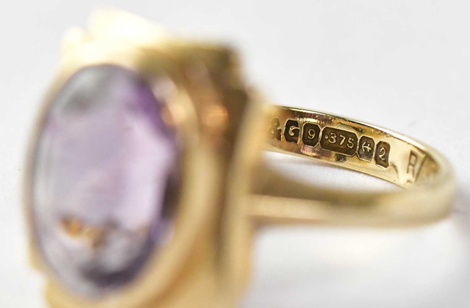 Four dress rings comprising a 9ct gold ring set with amethyst, stamped 375, size M1/2, approx. 4.6g, - Image 2 of 5