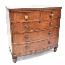 A Victorian mahogany bow-fronted chest of two short over three long graduated drawers, on turned