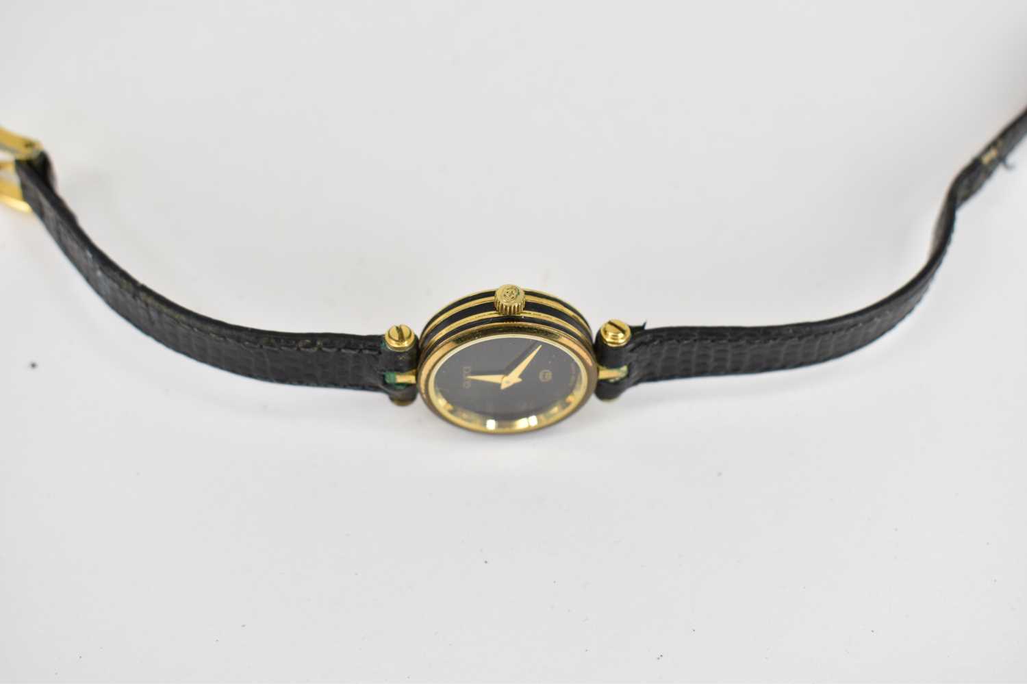 GUCCI; a ladies' dress watch, the black dial with gold hands, on a black strap. - Image 3 of 3