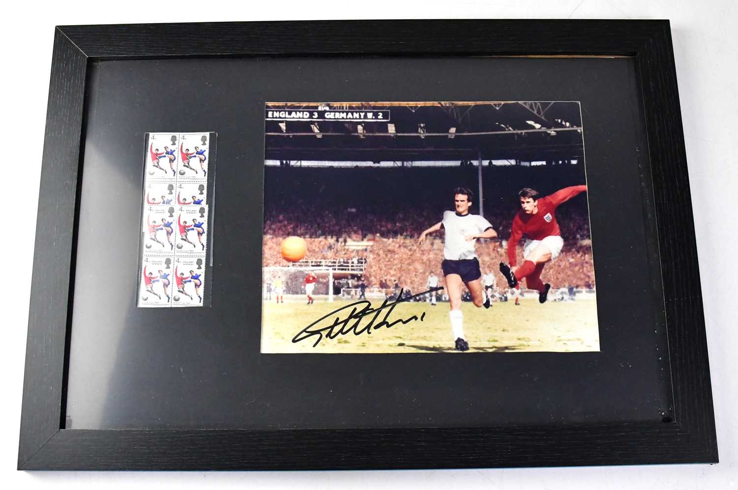 SIR GEOFF HURST; a signed colour photograph of him scoring the hat trick goal in the 1966 World