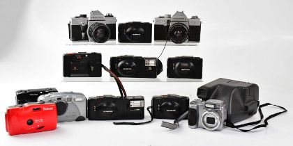 Various cameras to include Polaroid, Olympus film cameras, Praktica Super TL3 35mm, Praktica LLC